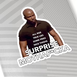 May include: A die-cut sticker featuring a person in a dark brown polo shirt with white text that reads ALL RISE, TRUE LIES, SOME FRIES, NICE THIGHS, SURPRISE, MOTHAF*CKA, placed on a light grey skateboard deck with a silver metal truck and white wheels.