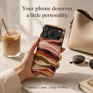May include: A phone case featuring a textured, wavy pattern in shades of brown, tan, pink, and cream. The text "Your phone deserves a little personality." and "Likhaya Cases | Shop on Etsy" is visible in the image.