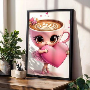 May include: A framed wall art print featuring a pink coffee cup character with large brown eyes, wearing a pink tutu and ballet slippers, holding a large pink heart. The cup contains coffee with latte art, and small pink hearts float above.