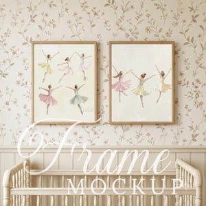 May include: Two rectangular wooden frames containing watercolor-style illustrations of ballet dancers in various poses. The left frame displays five dancers in pink, yellow, and green tutus, while the right frame shows three dancers in pink and green.