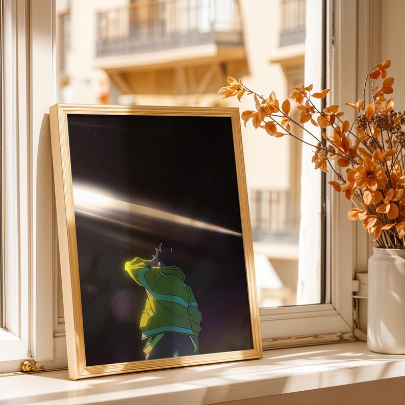 May include: A rectangular gold-toned frame containing an anime-style illustration of a figure in a green jacket looking up at a bright horizontal light beam against a dark, starry background. The artwork is displayed in a vertical orientation.