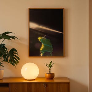 May include: A framed rectangular wall art print featuring an anime-style illustration of a figure in a bright lime green hooded jacket standing against a dark background with a horizontal beam of light cutting across the upper portion of the frame.