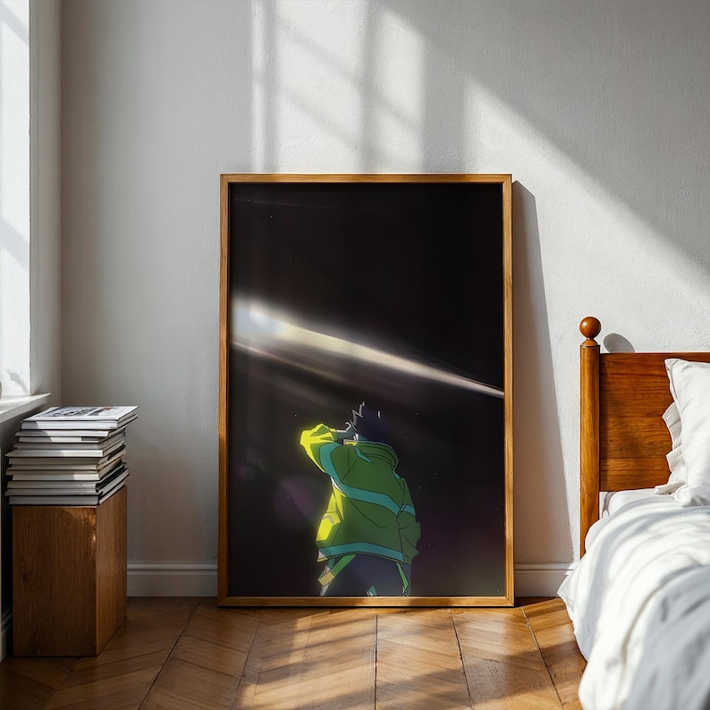May include: A rectangular framed wall art print featuring a dark, night-time scene with a person seen from behind wearing a bright neon green jacket. A single, sharp beam of white light cuts diagonally across the black background above the figure.