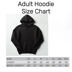 May include: A black hooded sweatshirt with a front kangaroo pocket and matching drawstrings. Above the hoodie, the text reads Adult Hoodie Size Chart. Below, a table lists sizes from XS to 3XL with chest and body length measurements in inches.