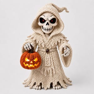 May include: A crocheted figure of a skeleton wearing a hooded beige robe with a dark gem at the waist. The skeleton has red eyes and holds a bright orange crocheted pumpkin with a glowing light inside. The robe features frayed edges at the hem.