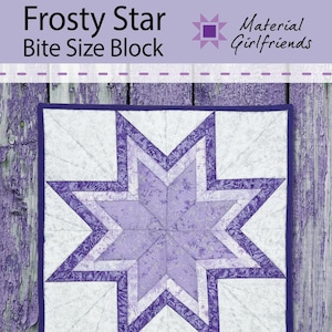 May include: A purple and white quilt block with a star design. The block is called "Frosty Star Bite Size Block" and is made by Material Girlfriends.