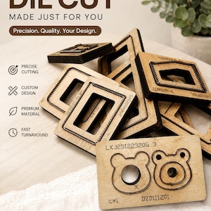May include: A collection of wooden die cut tools with metal blades, featuring various geometric and bear-shaped designs. The wooden bases are engraved with alphanumeric codes like LXJ25122320G 3 and DZ0111201. Text on the image includes CUSTOM DIE CUT, MADE JUST FOR YOU, Precision. Quality. Your Design., PRECISE CUTTING, CUSTOM DESIGN, PREMIUM MATERIAL, FAST TURNAROUND, and MADE TO MATCH YOUR PROJECT PERFECTLY.