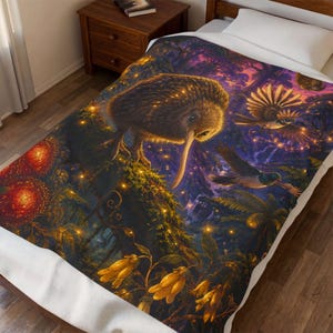 May include: A plush blanket featuring a vibrant, detailed illustration of a brown kiwi bird standing on a mossy branch in a dark, glowing forest. The scene includes flying birds, glowing yellow lights, and orange flowers against a purple sky.