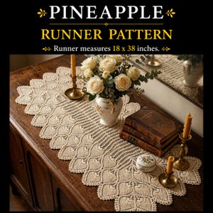 May include: A cream-coloured crochet table runner featuring a pineapple motif pattern with scalloped edges. The runner measures 45.7 x 96.5 cm. The design includes intricate openwork stitching throughout the length of the textile piece.