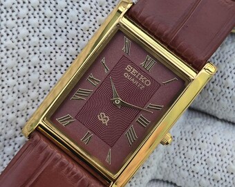 Vintage Seiko Quarz Tank Burgund Zifferblatt Gold Ton rechteckige Gehäuse braune Lederarmband Uhr