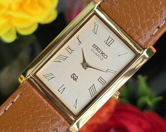 Vintage Seiko Quartz Tank Goldenes Zifferblatt Gold-Ton rechteckige Gehäuse braune Lederarmband Uhr