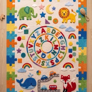 May include: A rectangular area rug with a cream-colored center and a border of multicolored interlocking puzzle pieces. The rug features a central circular alphabet design, a green elephant, a yellow lion, a blue whale, a red fox, and cars.