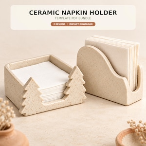 May include: Two beige speckled ceramic napkin holders, one featuring a pine tree cutout design and the other with a curved silhouette, both holding stacks of white paper napkins. Text at the top reads CERAMIC NAPKIN HOLDER.