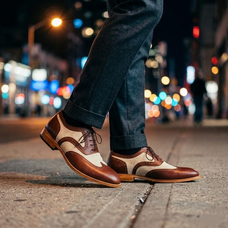 Detail view of the stacked leather heel and natural wood-grain finish of a bespoke men's shoe