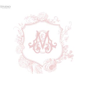 May include: A pink floral design with a shield in the center. The shield has a monogram of the letters "A" and "M" in a decorative font.