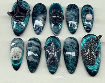 Uñas esculpidas con forma de ojo de gato marino de aguas profundas