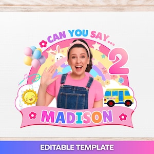 May include: A digital graphic template featuring a person in a pink shirt and denim overalls waving. The design includes a rainbow, a yellow sun, a yellow school bus, a cluster of balloons, a white bunny, and the text CAN YOU SAY... 2 MADISON.