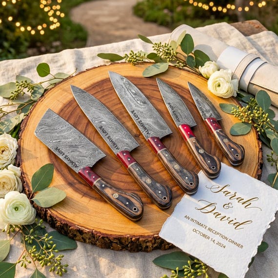 Full-tang, hand-forged Damascus steel chef knives with custom engraving — the kind of heirloom kitchen set a serious cook or groomsman actually remembers.
