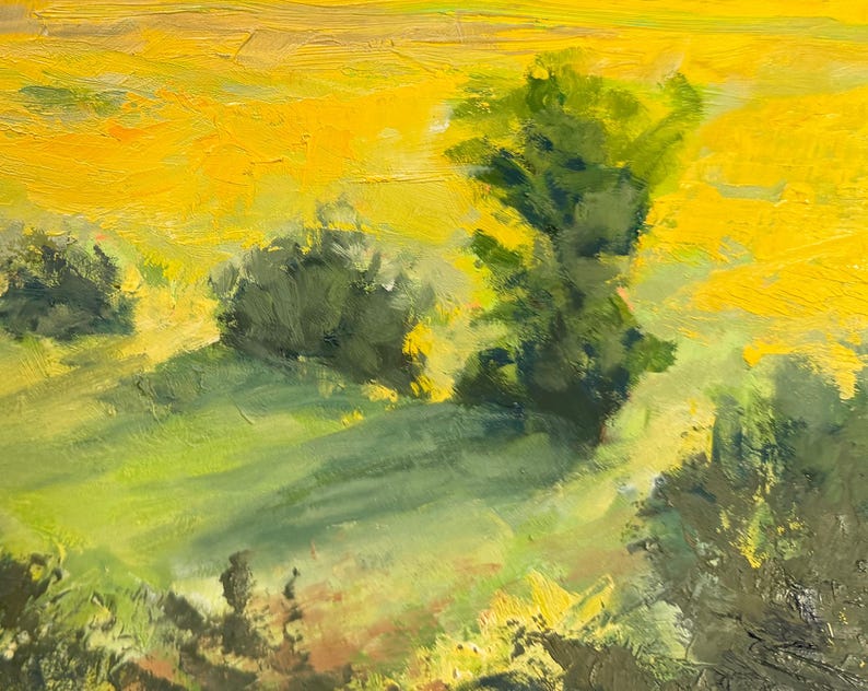 Detail of Dawn Chandler’s original New Mexico landscape painting Abiquiu Field of Summer Gold, centering on sunlit trees and bushes casting long shadows across warm green grass, with loose, painterly marks suggesting the yellow field beyond.