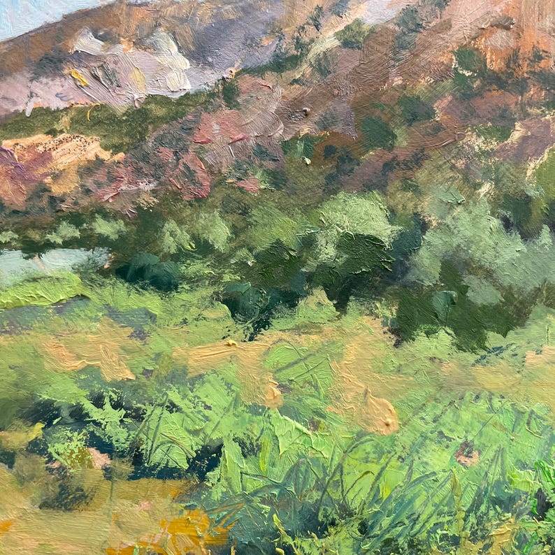 Close-up of original New Mexico landscape oil painting “Finding My Way to Pedernal” by Santa Fe artist Dawn Chandler, focusing on richly textured green shrubs, cottonwoods and sunlit meadow grasses at the base of colorful mesas, with layered brushwork and nuanced greens that highlight Chandler’s expressive impressionist landscape style.