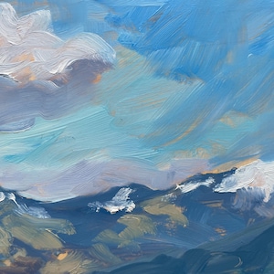 Close-up of original New Mexico landscape painting Spring Morning Over the Taos Mountains by Santa Fe artist Dawn Chandler, emphasizing the luminous sky and snow-capped Taos mountains, with sweeping blue and aqua brushstrokes, touches of peach and lavender light near the horizon, and creamy white clouds hovering above deep indigo ridges, showcasing the loose, expressive oil paint handling and atmospheric spring morning light.