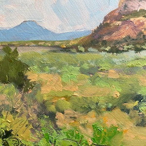 Close-up of the foreground from “Finding My Way to Pedernal,” an original New Mexico landscape oil painting by Santa Fe artist Dawn Chandler, featuring thick, gestural strokes of yellow-green grasses, sage and shadowed earth that lead the eye into distant mesas; a richly textured Southwest landscape by Dawn Chandler.