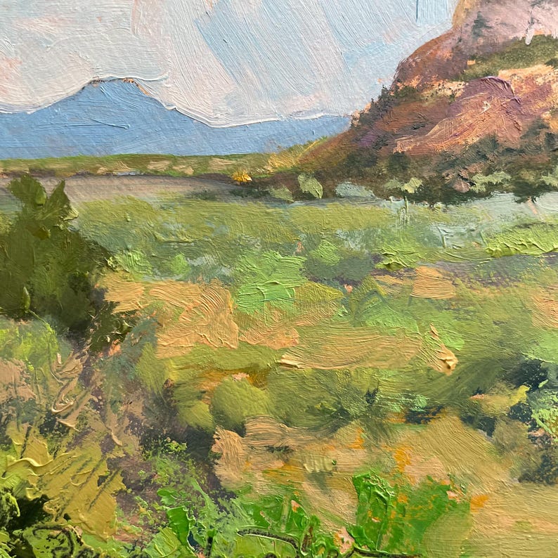 Close-up of the foreground from “Finding My Way to Pedernal,” an original New Mexico landscape oil painting by Santa Fe artist Dawn Chandler, featuring thick, gestural strokes of yellow-green grasses, sage and shadowed earth that lead the eye into distant mesas; a richly textured Southwest landscape by Dawn Chandler.