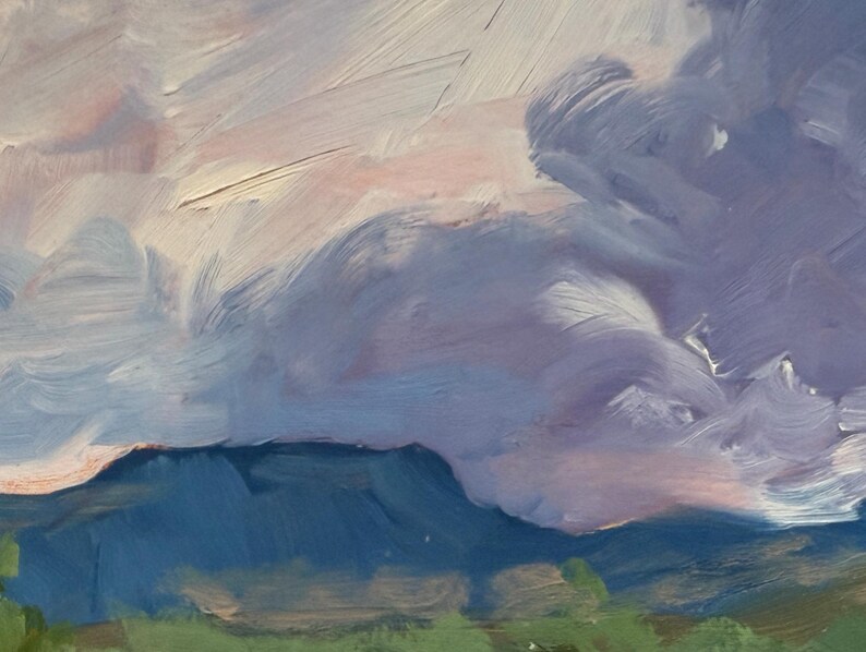 Upper-section detail of Abiquiu Field of Summer Gold, an original New Mexico landscape oil painting by Santa Fe artist Dawn Chandler, emphasizing dramatic lavender and blue storm clouds rolling above distant blue mesas and mountains green tree tops, evoking changing weather in the Rio Chama valley.