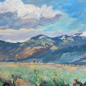 Original New Mexico landscape oil painting Spring Morning Over the Taos Mountains by Santa Fe artist Dawn Chandler, showing a wide Taos valley with thick palette-knife foreground grasses, soft turquoise and sage greens, distant blue-violet mountains with lingering snow, and a vast, expressive sky of sweeping clouds and light-filled blue brushstrokes, capturing the freshness and energy of a high desert spring morning.
