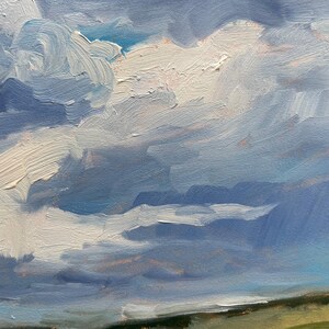 Another close‑up of the sky from Dawn Chandler’s original New Mexico landscape painting Under a High Country August Sky, featuring sweeping strokes of blue, lavender, and white oil paint forming layered clouds above a sliver of distant hillside, highlighting the expressive texture and atmospheric light of the high‑country August sky.