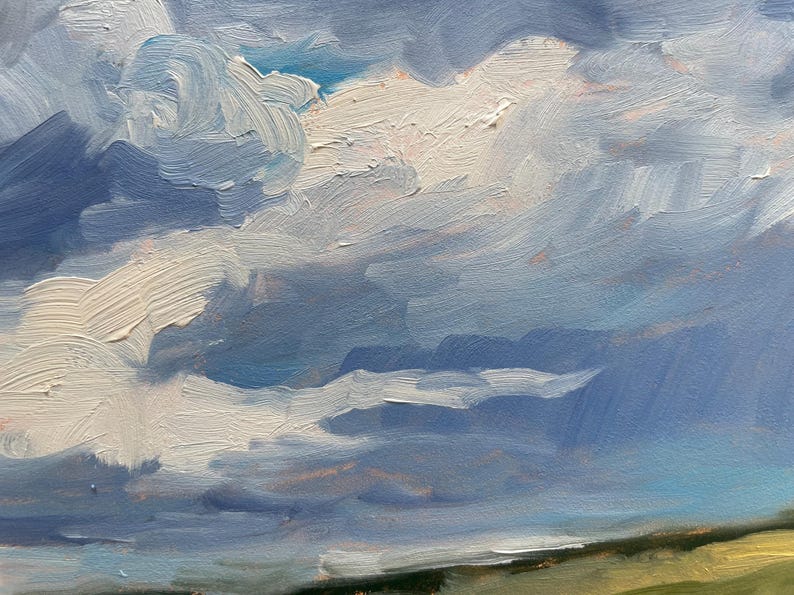 Another close‑up of the sky from Dawn Chandler’s original New Mexico landscape painting Under a High Country August Sky, featuring sweeping strokes of blue, lavender, and white oil paint forming layered clouds above a sliver of distant hillside, highlighting the expressive texture and atmospheric light of the high‑country August sky.
