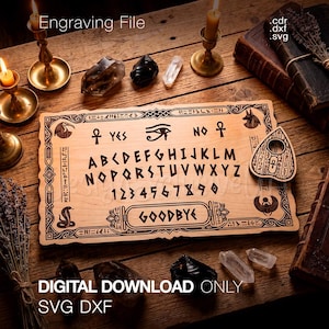 May include: A rectangular wooden spirit board featuring engraved letters A through Z, numbers 0 through 9, the words YES, NO, and GOODBYE, and Egyptian symbols including an Eye of Horus. A matching planchette is included on the right side.