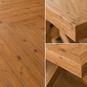 May include: A light brown wooden table featuring a distinct herringbone pattern on the tabletop surface. The wood displays a natural grain with visible knots and a smooth finish, showcasing the joinery at the corners and the sturdy construction.