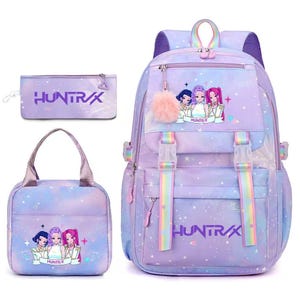 May include: A purple and blue gradient backpack, lunch bag, and pencil case set featuring a star pattern and the text HUNTR/X. The backpack includes rainbow straps, a fluffy pink pom-pom charm, and a graphic of three anime-style characters.