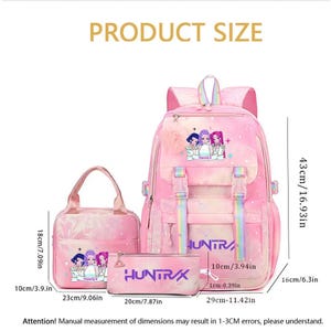 May include: A pink gradient backpack, lunch bag, and pencil case set featuring anime-style characters and the text "HUNTRAX". The backpack measures 16.93 inches high, 11.42 inches wide, and 6.3 inches deep, with rainbow straps and a fluffy charm.