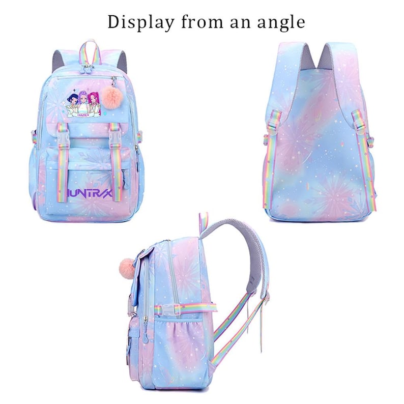 May include: A pastel-colored backpack featuring a gradient of blue, pink, and purple with a firework pattern. The front displays the text "HUNTRX" and a graphic of three characters, accompanied by a fuzzy pink pom-pom charm and rainbow straps.