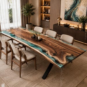 May include: A large rectangular dining table featuring a natural live-edge wood slab with a central translucent teal resin inlay. The table is supported by black metal legs and is surrounded by six chairs with light beige upholstered seats.
