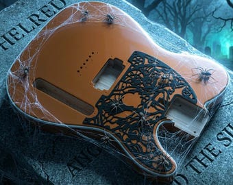 May include: An orange electric guitar body featuring a black intricate gear-themed overlay, covered in spiderwebs and small spiders. The guitar body rests on a stone tombstone engraved with the text AETHELRED and THE SILENT.