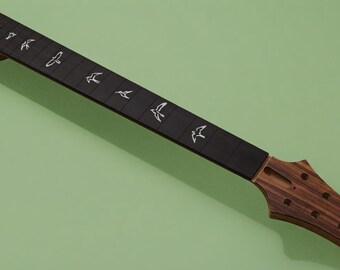 May include: A guitar neck featuring a dark wood headstock with six tuning peg holes and a black fretboard. The fretboard is inlaid with white bird-shaped markers positioned along the frets, extending from the nut toward the heel.