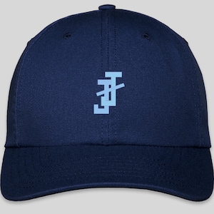 May include: A navy blue baseball cap with a light blue embroidered logo on the front. The logo is a stylized letter "F" with a diagonal line through it.