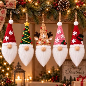 May include: Five hanging crochet gnome ornaments with white faux fur beards and wooden bead noses. The gnomes feature pointed hats in red with snowflakes, green with a yellow star, tan with reindeer antlers, pink with snowflakes, and red with a small top hat.