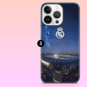 May include: A smartphone case featuring a night sky background with a starry galaxy above a large illuminated stadium. The white Real Madrid football club logo is positioned in the upper center. The number 3 is displayed in a black circle on the left.