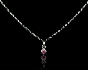 Ruby round rhodium plated Sterling Silver necklace