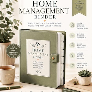 May include: A sage green home management binder with a snap closure, featuring a white label with the text HOME MANAGEMENT BINDER, SIMPLE SYSTEMS. CALMER HOME. MORE TIME FOR WHAT MATTERS. It includes internal tabbed dividers for planning and finances.