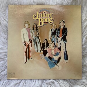 May include: Vintage vinyl record album cover featuring the band Jukin' Bone. The album art shows six band members in 1970s attire against a tan background. The band's name is in a stylized font at the top. The RCA Victor logo is in the bottom left corner.