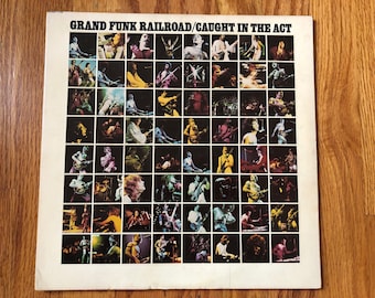 Grand Funk Railroad Caught In The Act, 1975 Capitol Records SABB-11445, Embossed Title and on back debossed "For Sale to U.S. Military"