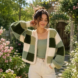 May include: A long-sleeved crochet cardigan featuring a patchwork design of square blocks in shades of forest green, sage green, and cream. The garment has a ribbed trim along the front opening and cuffs, with a loose, open-front construction.