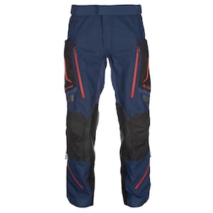 May include: Navy blue trousers featuring black reinforced panels on the knees and thighs, bright red zippered pockets, and red accents. The garment includes a waistband with a central closure and reflective detailing on the lower leg sections.