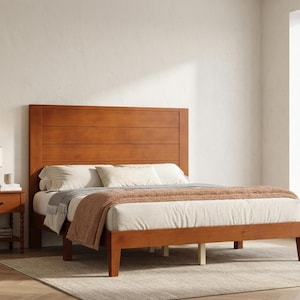 May include: A wooden bed frame with a tall, horizontal plank headboard in a warm brown finish. The bed is dressed with white bedding, a gray throw blanket, and a textured brown blanket. A matching wooden nightstand sits to the left of the bed.