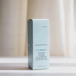 May include: A light blue rectangular skincare product box labeled SkinCeuticals C E Ferulic. The text indicates it is a combination antioxidant containing 15% L-ascorbic acid, 1% alpha tocopherol, and 0.5% ferulic acid, with a volume of 30 ml / 1 fl oz.